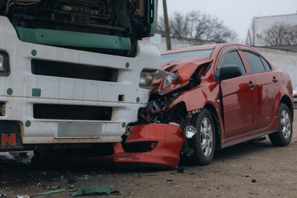 trucking accident car collided on highway serious